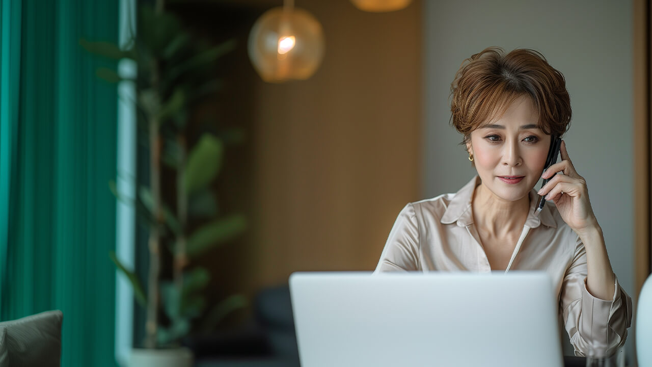 Woman working on a laptop in an office